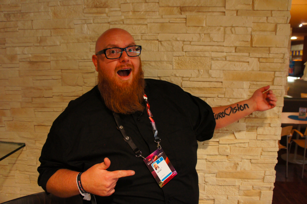 Jason Watkins showing off his Eurovision tattoo